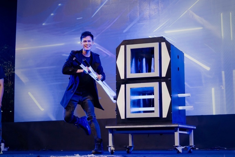 Zach NG performing a grand illusion